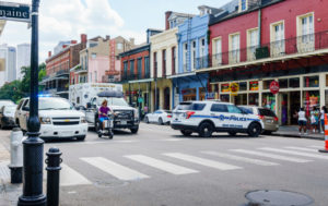 Emergency vehicles leave after a car accident in New Orleans