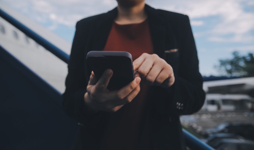 Woman using phone to scan social media.